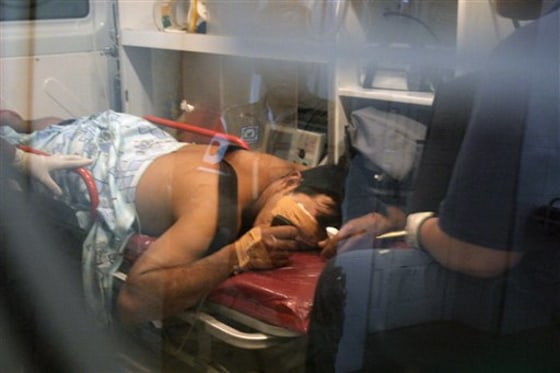 A police officer, injured during a bomb attack to a police station, is taken to a hospital in Asuncion, Paraguay, on Monday. The bomb exploded just before midnight Sunday at a police station in the northern town of Horqueta, where many fugitives from a guerrilla group calling itself the Paraguayan People's Army, claiming responsibility for the attack, are from. Four police officers were injured. 